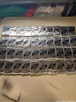 40 sealed 1992-93 Upper Deck Hockey Series 1 trading card booster packs arranged on a table in rows, showing silver foil sealed fronts with logos.
