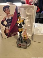 Photo of the Zatanna statue with damaged box and styrofoam packaging visible behind.