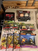 Overview photo showing all boxed figures and playsets arranged on a table