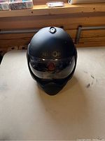 Front view of black Roof Boxer helmet with clear visor and Roof logo on front.