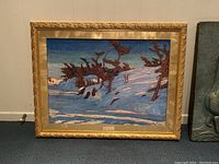 Full view of the framed A.Y. Jackson print showing the winter landscape scene and ornate gold frame.
