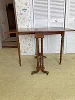 Front view of vintage gateleg table with leaves down