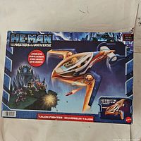 Front of the new sealed original box showing artwork of the Talon Fighter playset from He-Man and the Masters of the Universe by Mattel.