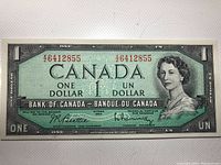 Front side of the 1954 Canadian one dollar banknote showing Queen Elizabeth II portrait and serial numbers.