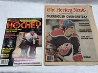 Photo showing both magazines side by side on a white surface: The Hockey News with Wayne Gretzky headline and Inside Hockey 1980 issue with goalie on front cover.