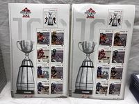 Photo showing two 2012 Grey Cup souvenir stamp sheets, each containing 9 permanent stamps, featuring football players and the Grey Cup trophy graphic.