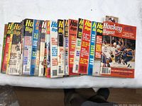 Top view showing 22 Hockey Digest magazines arranged in a row with visible colorful covers from the 1970s period.