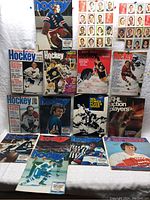 Photo showing 12 vintage NHL hockey magazines with various player covers including goalies and skaters from the 1970s.