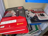 Photo showing a stack of SanDisk flash drives in original packaging, includes Cruzer Glide 256GB model.