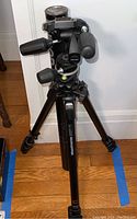 Full view of Manfrotto tripod with pan-tilt head, three-section legs and flip locks