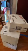 Two stacked sealed boxes: Zenith vac312 on Boston Acoustics MicroMedia