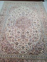 Full top view of rug showing medallion and border pattern