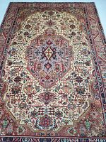 Overhead view showing entire rug with central medallion and border