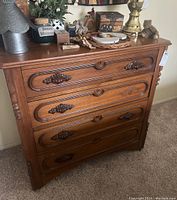 Angled front view showing overall dresser and top surface