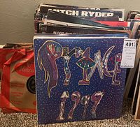 Front record sleeves showing Prince '1999' album with blue cover art