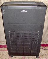 Front view of black RespirAide air purifier showing front grille and brand name.