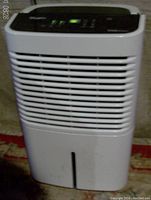 Front view showing overall housing and air intake grill