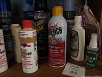 Photo displaying a group of cleaning supplies including Black Flag insect spray, Stain & Odor Remover, Liquid Wrench silicone spray, Blitzgraff cleaner, Cedar Fresh spray, and new sponges.