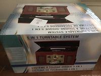 Photo of the closed system box showing 5-in-1 turntable system branding.
