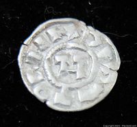 Front side showing cross and inscriptions of silver medieval Crusaders Denaro coin from Italy (1039-1125AD).