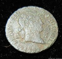 Obverse of 1833 Spanish 2 Maravedis coin showing profile of King Fernando VII with surrounding inscriptions.