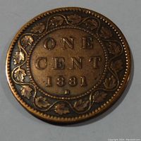 Reverse side of the 1881H Canada Victoria Large One Cent Coin showing denomination, year, and maple leaf wreath design.