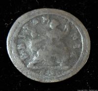 Reverse side of the same Great Britain Half Penny coin featuring a crown and partial text, worn by circulation.