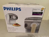 Front box showing the Philips pasta maker image, branding, and claim of fresh homemade pasta in 15 minutes.