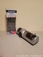 Full view of boxed Cuisinart 6-piece knife set with electric sharpener on white surface
