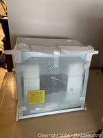 Showtime rotisserie oven front view, new in box packaging tape visible.