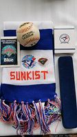 Full lot showing scarf, schedule, baseball, pins in and out of box, and blue velvet pin case.