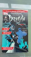 Front cover of Topps Comics Dracula official movie adaptation issue 2 of 4 in shrink wrap, showing artwork of Dracula and promotional texts about exclusive cards and poster.