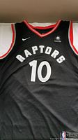 Front of black Toronto Raptors basketball jersey with number 10 and Raptors text.