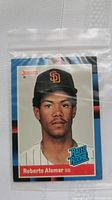 Front of Roberto Alomar rookie card showing portrait with San Diego Padres cap, Donruss logo, and Rated Rookie emblem.