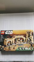 Front of the unopened LEGO Star Wars Boba Fett's Throne Room set box, showing minifigures and set build preview