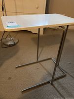 Photo of white composite top and chrome tubular metal frame showing overall condition and design.