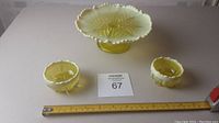 Overview of two open salts and cake stand with lot card and ruler for scale