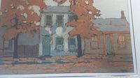 Overall view of the framed art print showing the houses and autumn foliage