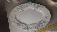White scalloped floral platter with blue grapevine floral pattern