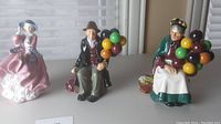 Front view showing all three figurines side by side on tabletop