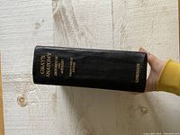 Spine view of the vintage Gray's Anatomy book showing gold embossed title and publisher 'Longmans'.