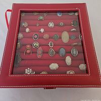 Closed view of red display box containing vintage rings
