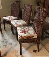 Three chairs arranged on tile floor showing front perspective