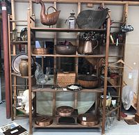 Front view of assembled shelving ensemble showing center and corner units loaded with miscellaneous items.