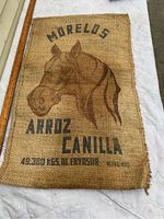 Front side of the sisal-jute grain bag showing horse head print and text
