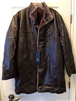 Full front view of the brown faux leather men's jacket with button closure and tags attached.