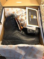 Single boot in open box with STC guarantee warranty card and tags