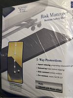 Photo of packaging showing the XL version of the Risk Manager Bedside Safety Mat with 5-way protection details and nano-silver infusion.