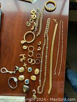 Overhead view on wooden table with assorted jewelry pieces