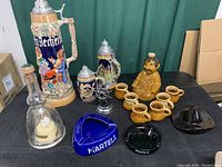 Full overview of German beer steins, Bols ballerina bottle, Jose tequila set, lighter and ashtrays